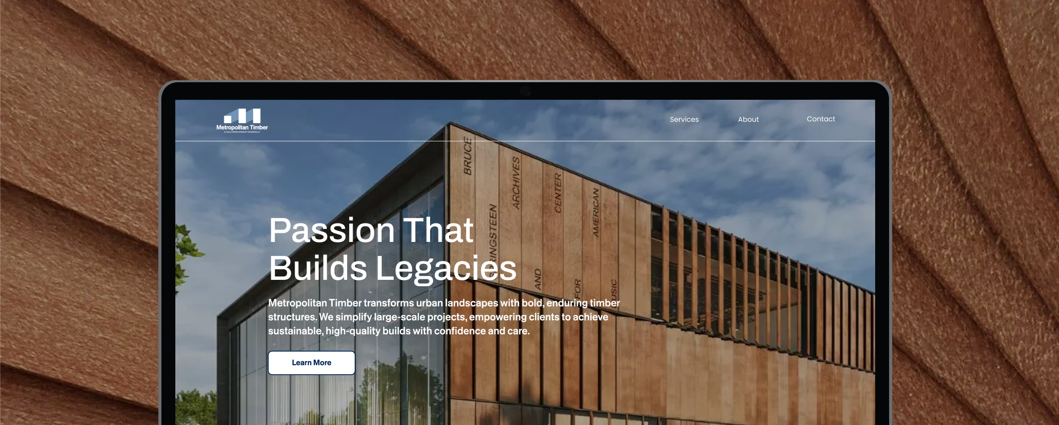 Metropolitan Timber website homepage on desktop, set against a timber texture background